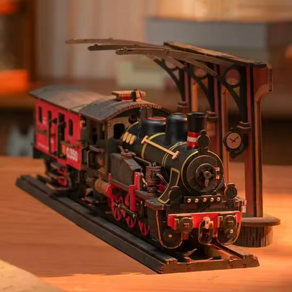 maquette en bois en forme de locomotive à vapeur noir et rouge 